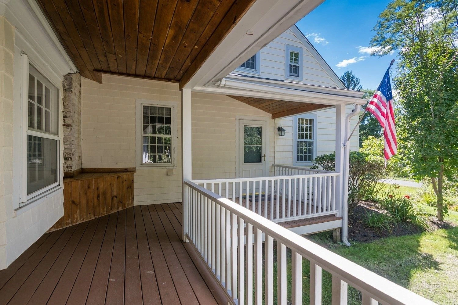 Wrap-around porch with railings